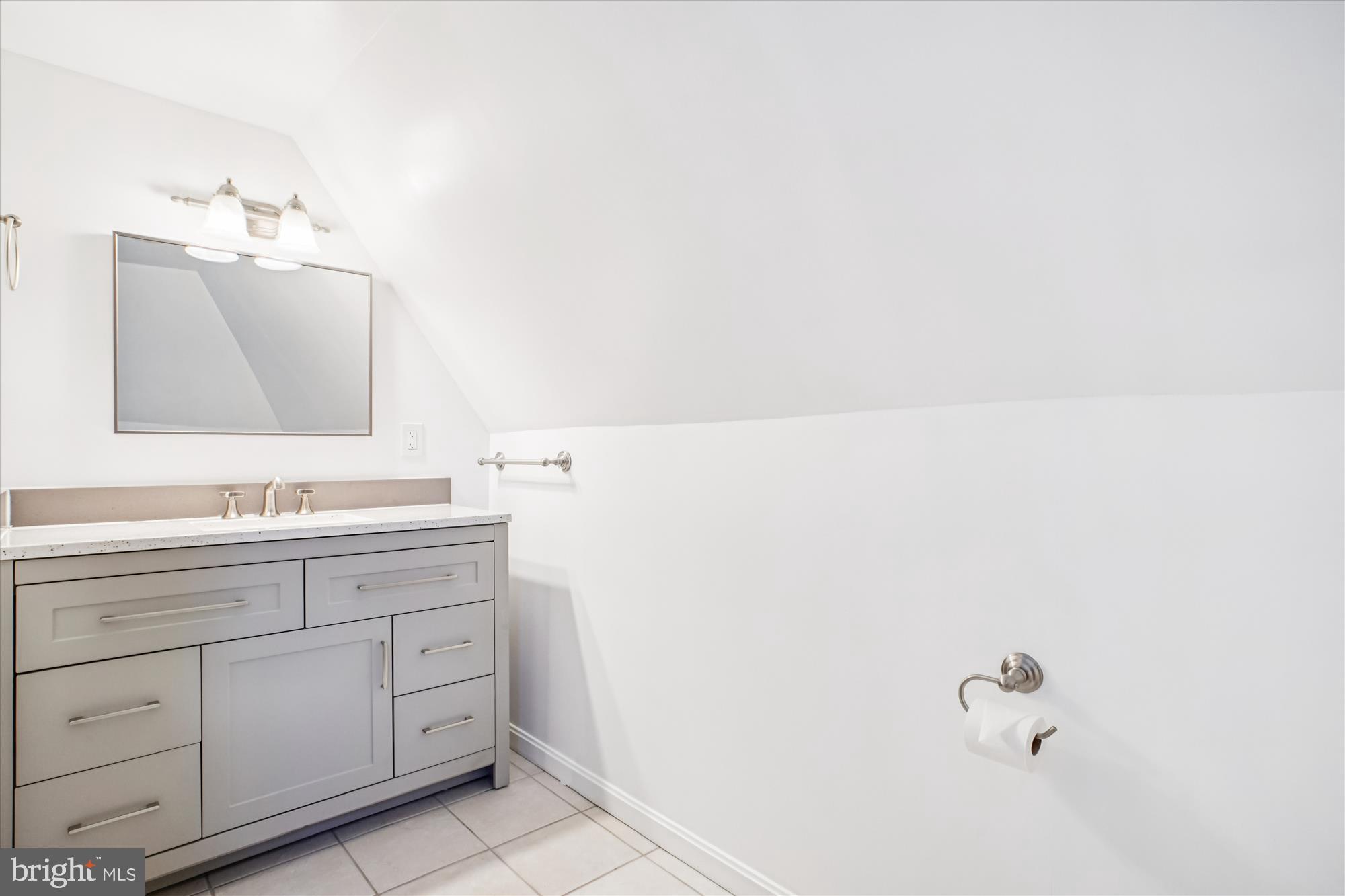 6022 Valley View Drive Alexandria, VA 22310 - Photo 18 of 50 a bathroom with a double vanity sink and mirror