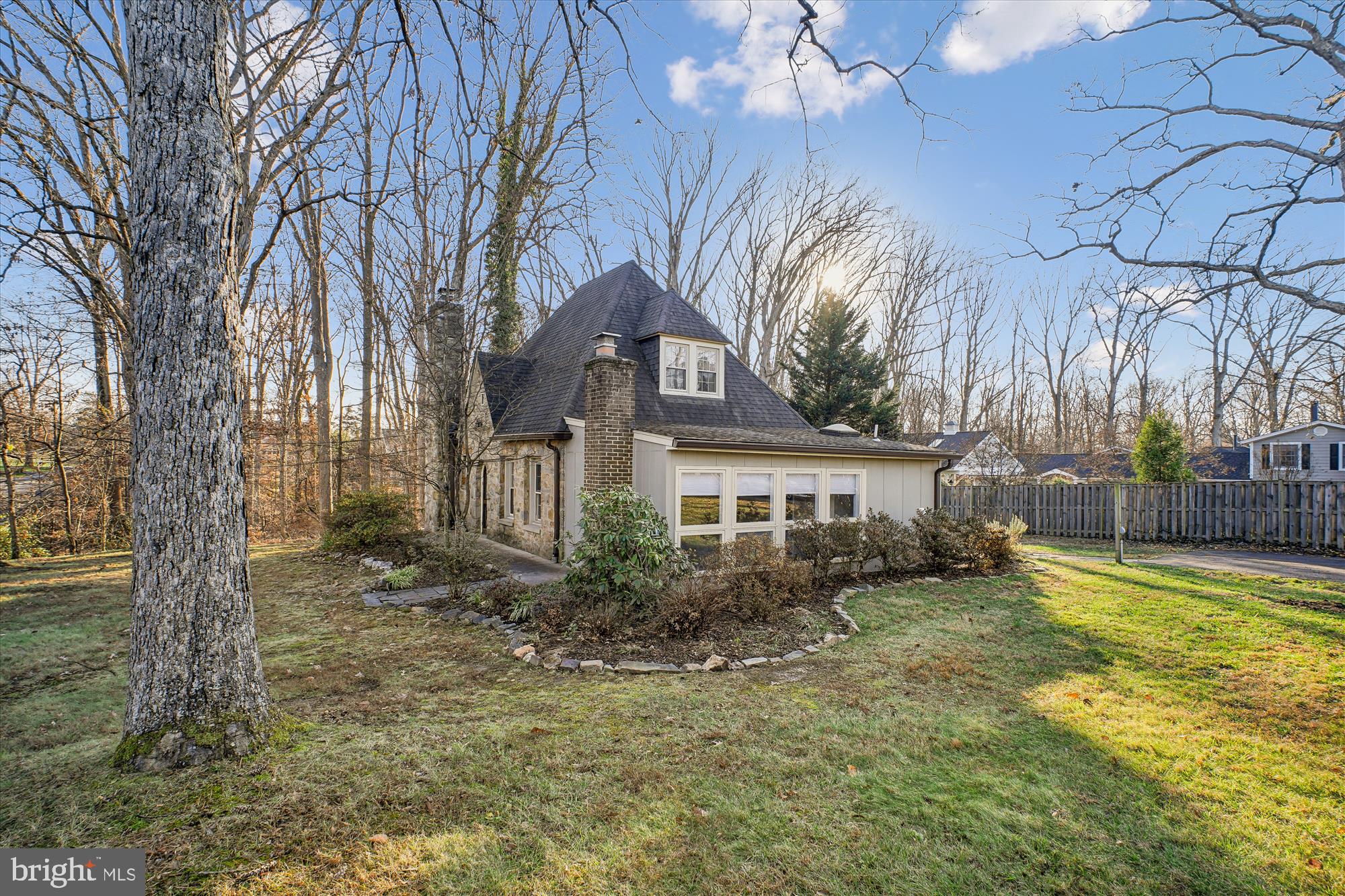 6022 Valley View Drive Alexandria, VA 22310 - Photo 28 of 50 a view of a house with a large tree and a yard
