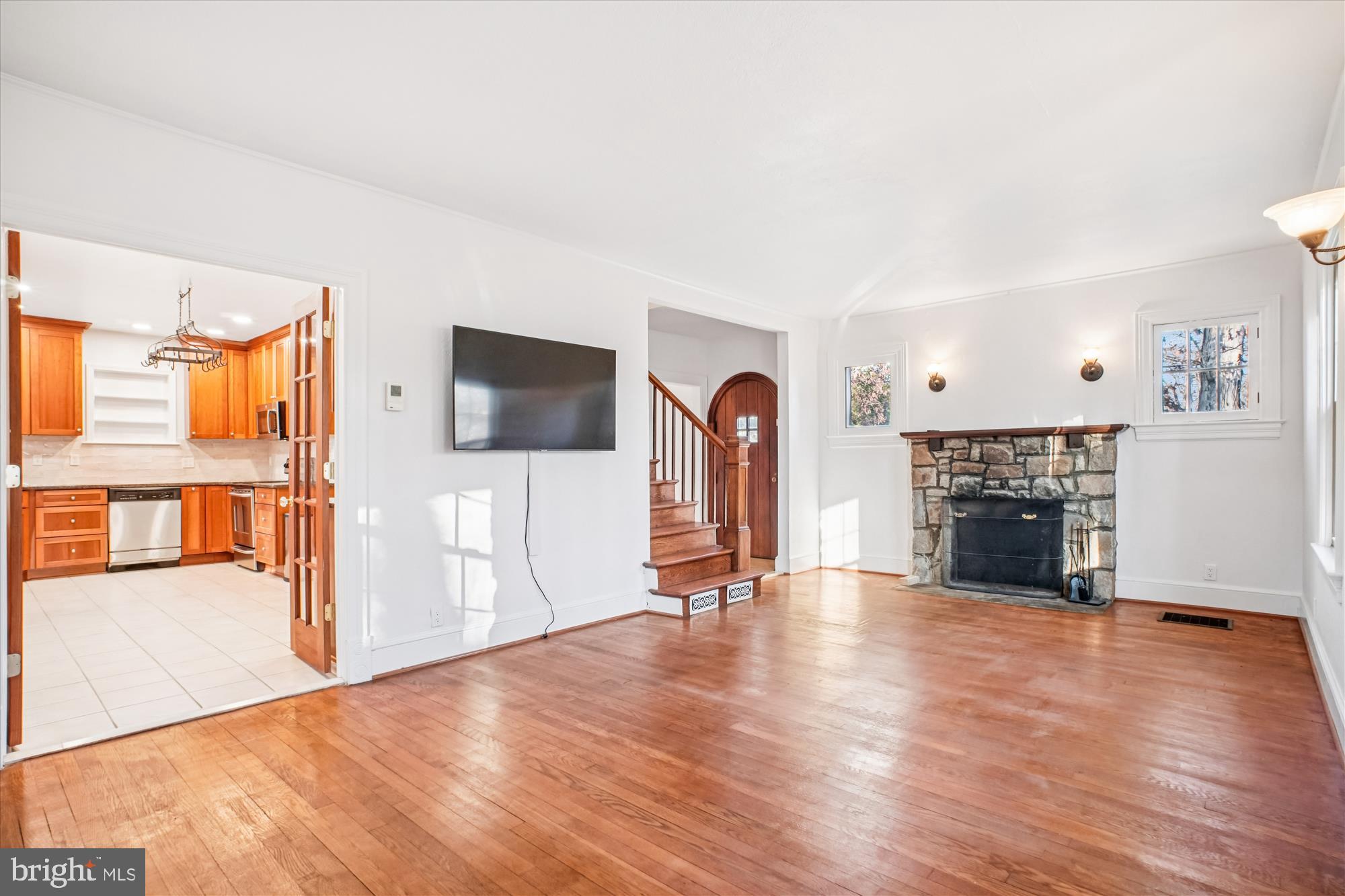 6022 Valley View Drive Alexandria, VA 22310 - Photo 3 of 50 a view of a livingroom with wooden floor and a fireplace