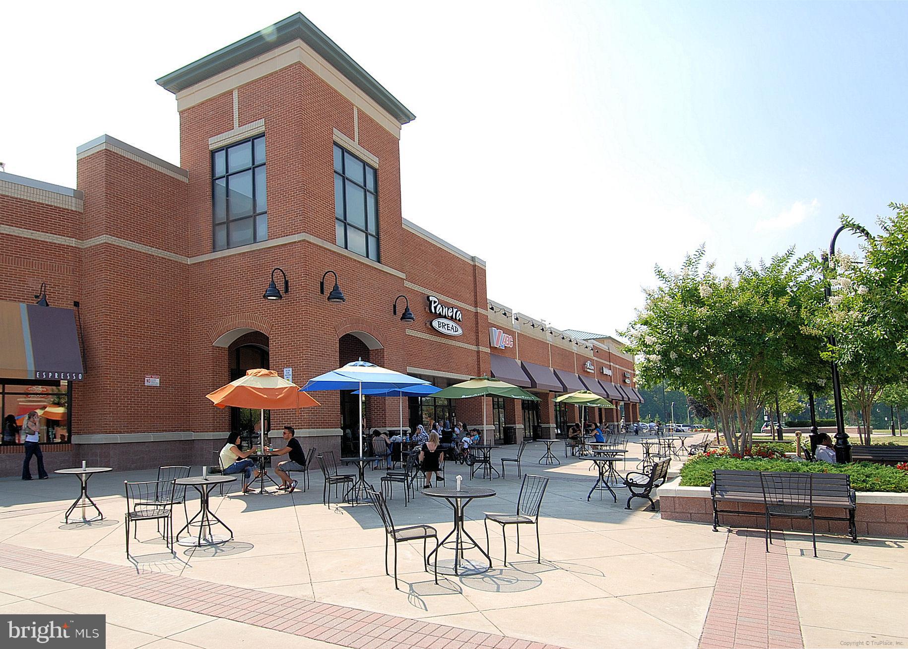6022 Valley View Drive Alexandria, VA 22310 - Photo 38 of 50 a patio with a table and chairs under an umbrella