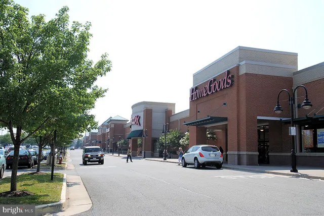 a view of a cars park in front of a building