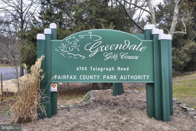 a view of a park that has sign board