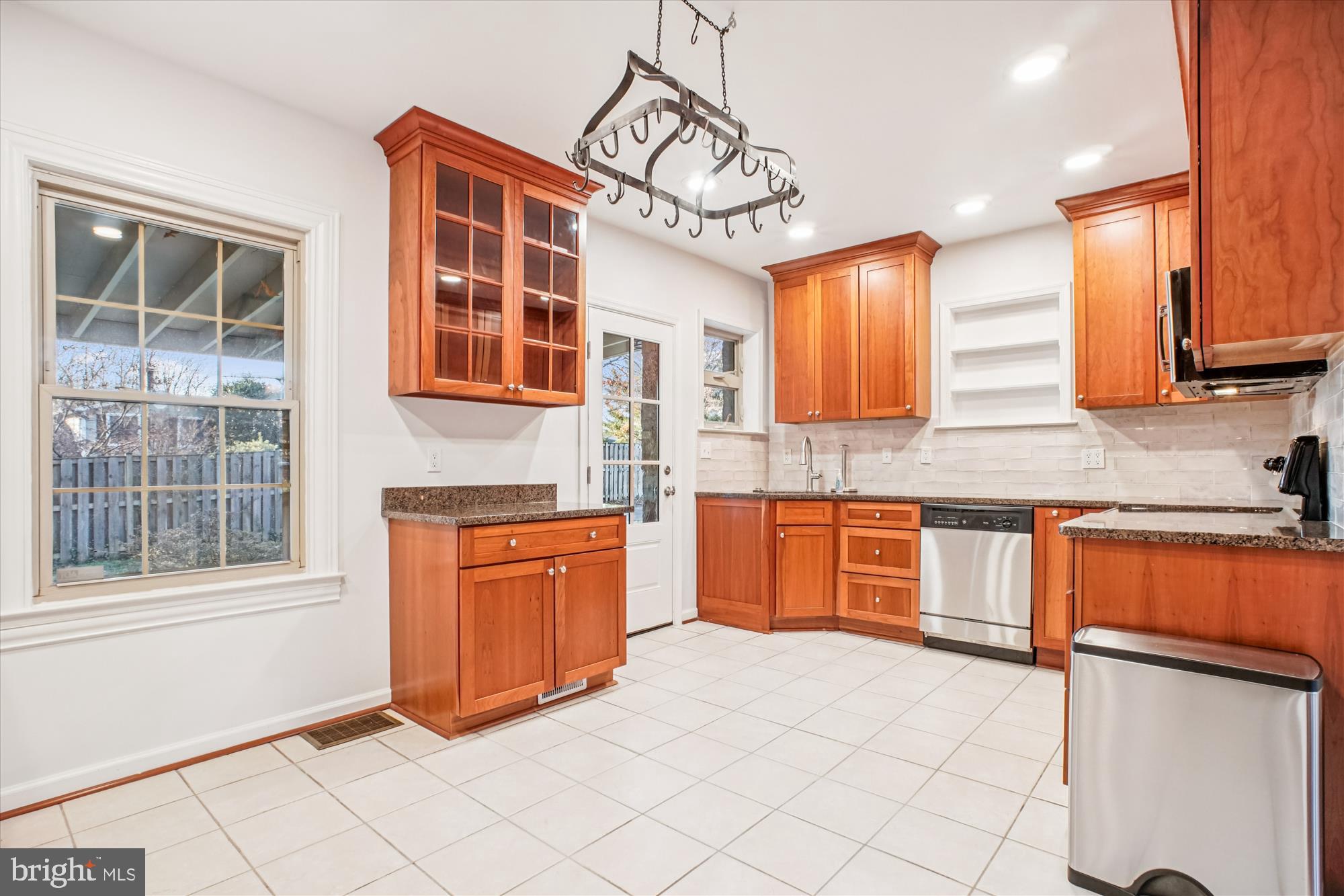 6022 Valley View Drive Alexandria, VA 22310 - Photo 8 of 50 a kitchen with stainless steel appliances granite countertop a stove a sink and a microwave
