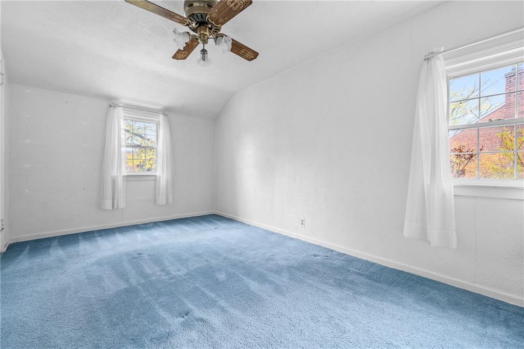 2058 Spring Valley Road Pittsburgh, PA 15243 - Photo 14 of 28 an empty room with windows and fan