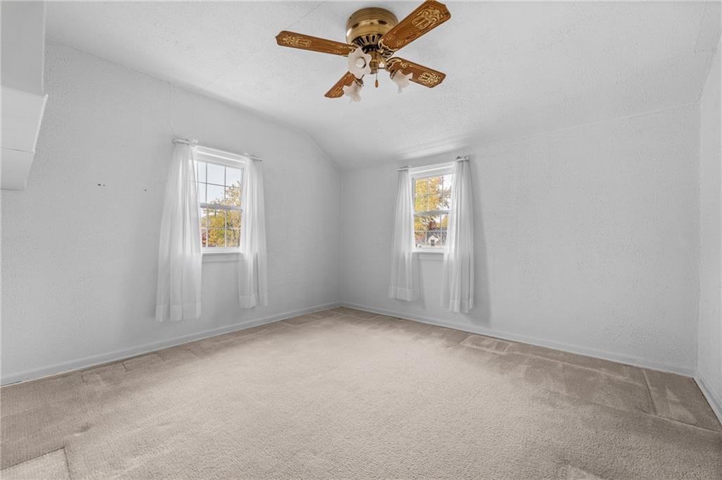 2058 Spring Valley Road Pittsburgh, PA 15243 - Photo 19 of 28 an empty room with windows and fan
