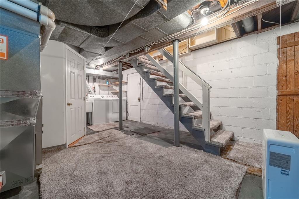 2058 Spring Valley Road Pittsburgh, PA 15243 - Photo 23 of 28 a view of a livingroom with wooden floor and stairs