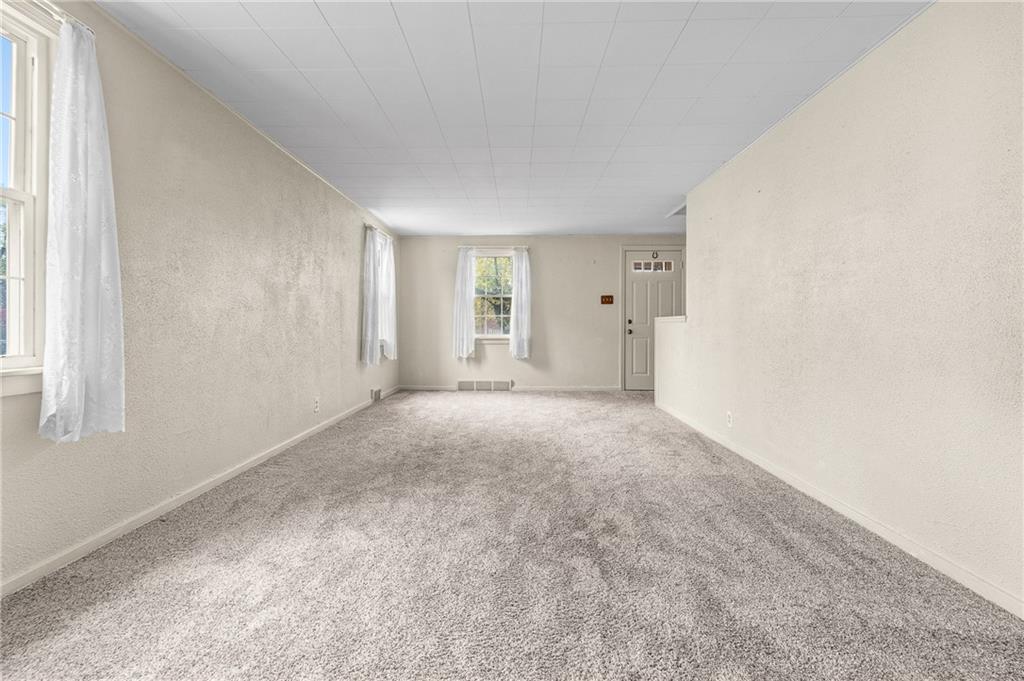 2058 Spring Valley Road Pittsburgh, PA 15243 - Photo 5 of 28 an empty room with windows and closet