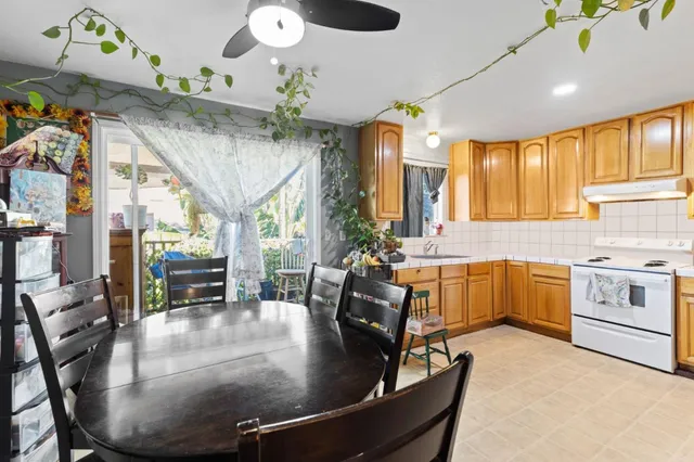 a bedroom with a bed table and chair