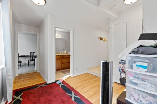 a kitchen with a table chairs and a refrigerator
