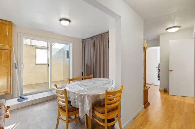 a kitchen with a refrigerator and a sink