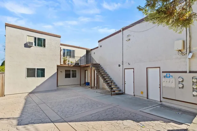 a view of a house with a hallway and stairs