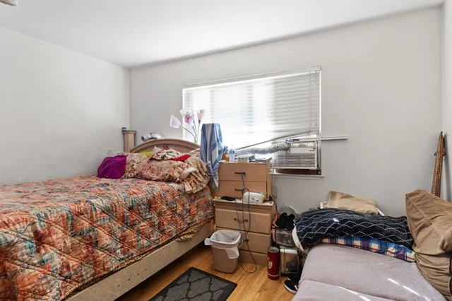 a view of a hallway with wooden walls and stairs