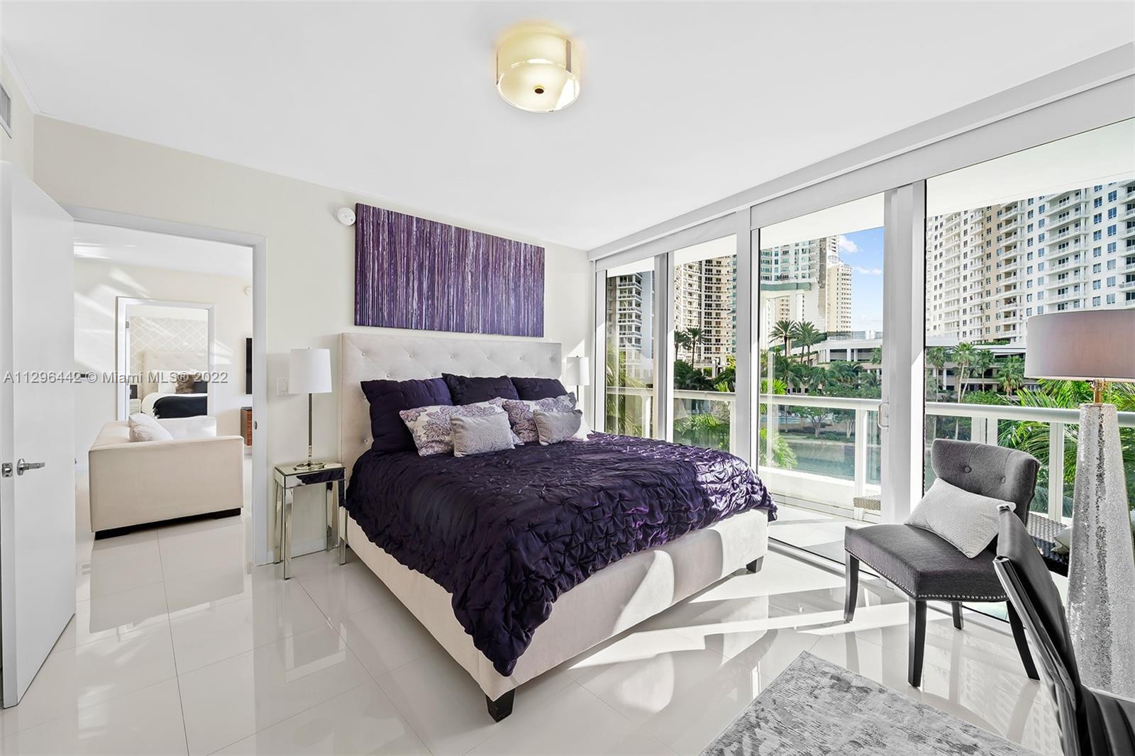 495 Brickell Avenue, Unit BAY405 Miami, FL 33131 - Photo 12 of 25 a bedroom with a bed and a large window