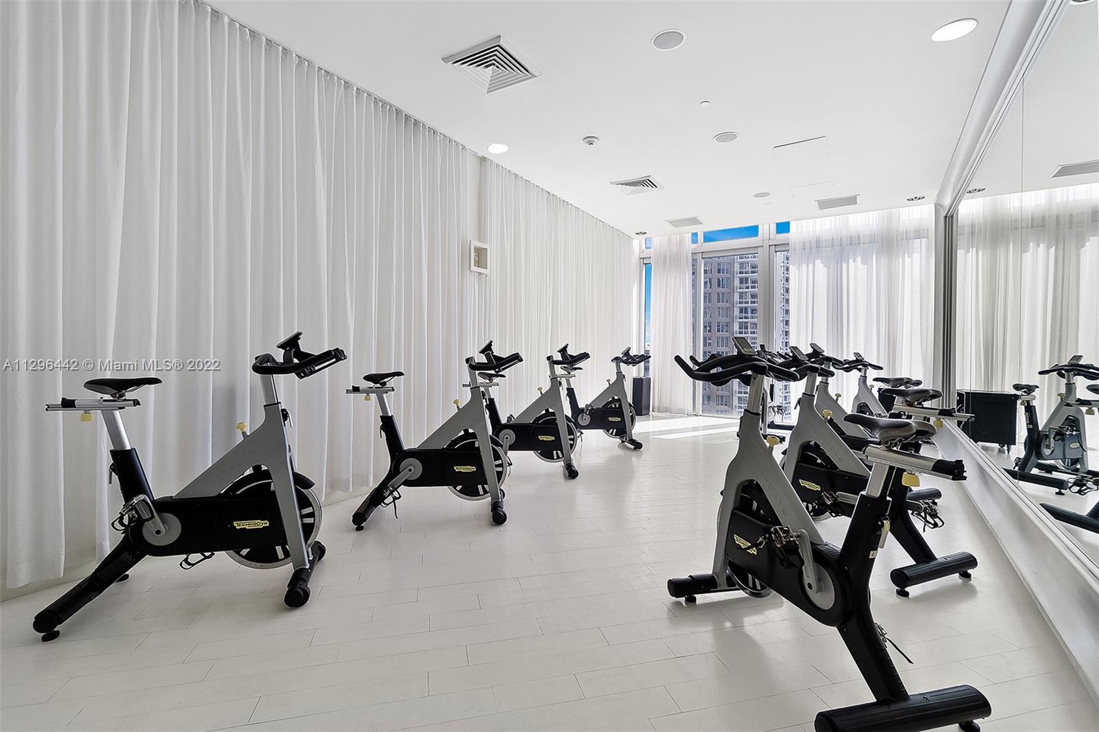 495 Brickell Avenue, Unit BAY405 Miami, FL 33131 - Photo 22 of 25 a view of a room with gym equipment