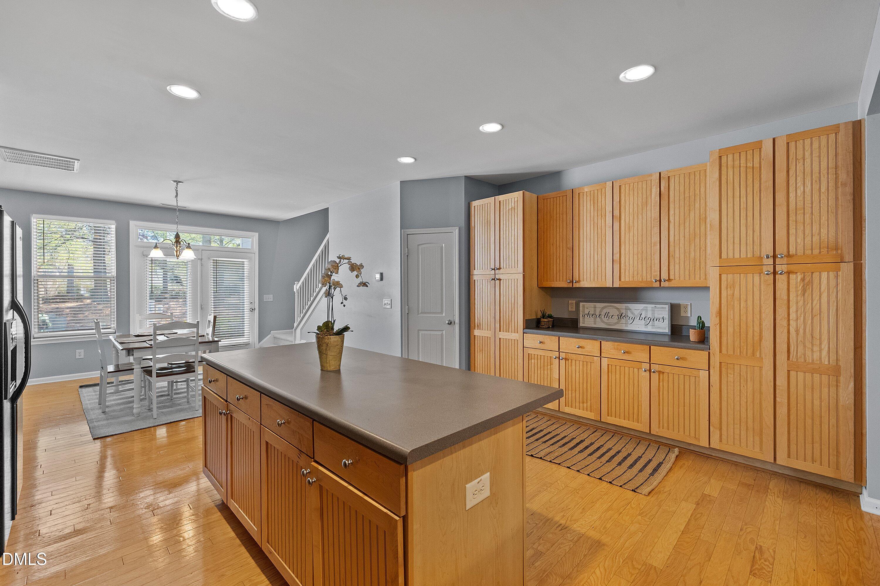 3114 Rapid Falls Road Cary, NC 27519 - Photo 11 of 37 a kitchen with kitchen island granite countertop a stove and a sink
