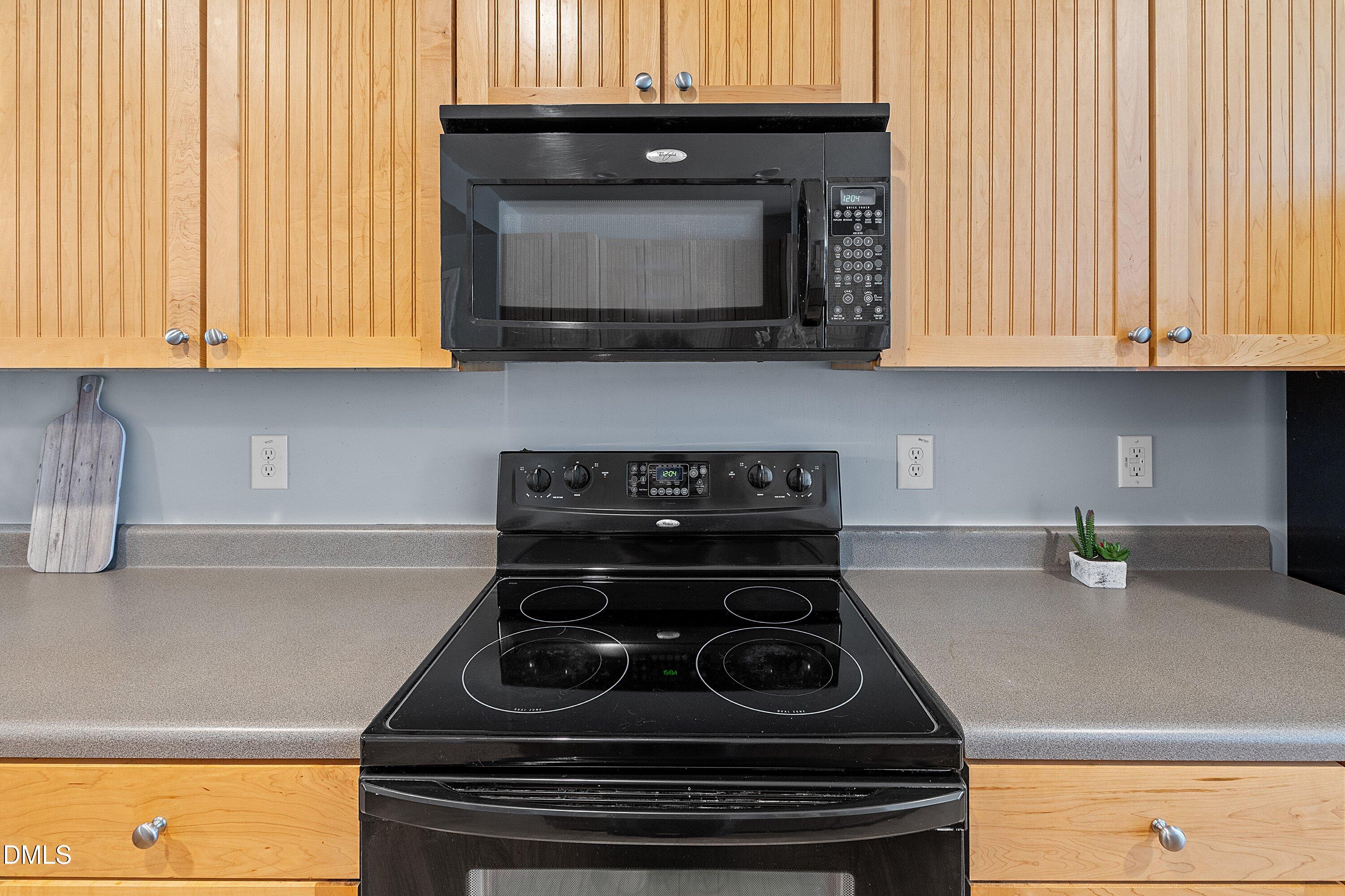 3114 Rapid Falls Road Cary, NC 27519 - Photo 14 of 37 a kitchen with a stove and a microwave