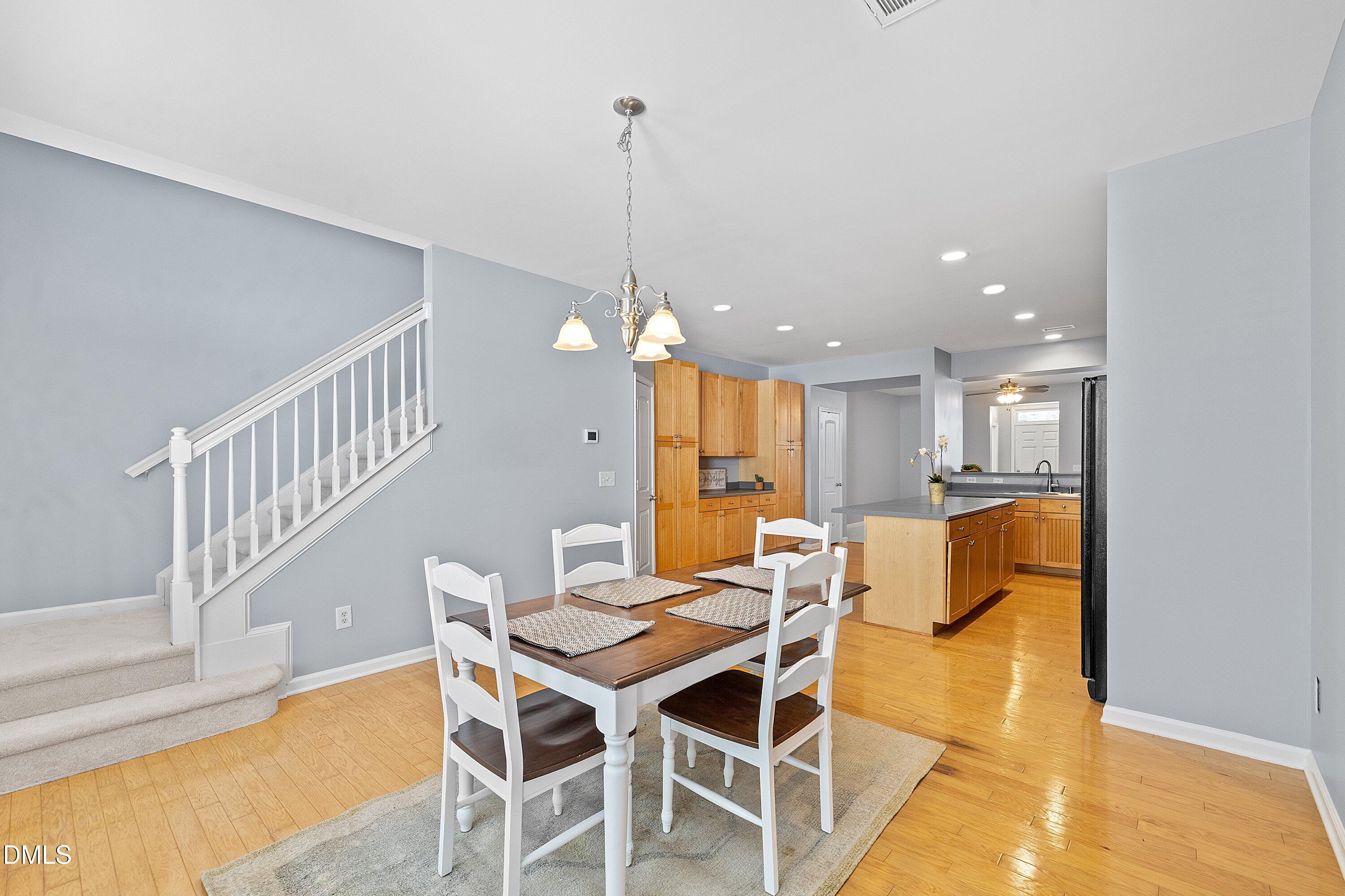 3114 Rapid Falls Road Cary, NC 27519 - Photo 15 of 37 a dining room with furniture and a chandelier