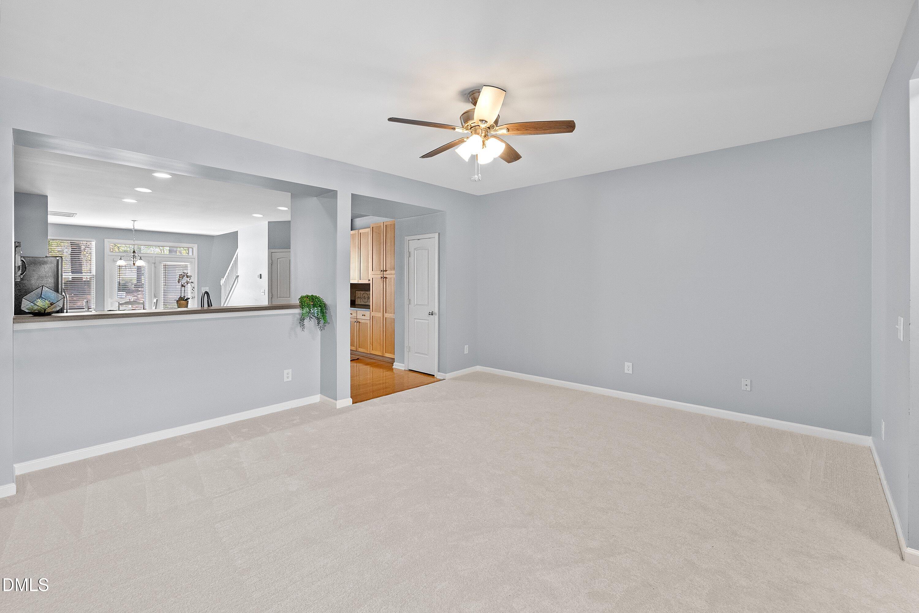 3114 Rapid Falls Road Cary, NC 27519 - Photo 17 of 37 a view of a kitchen with a microwave and a ceiling fan