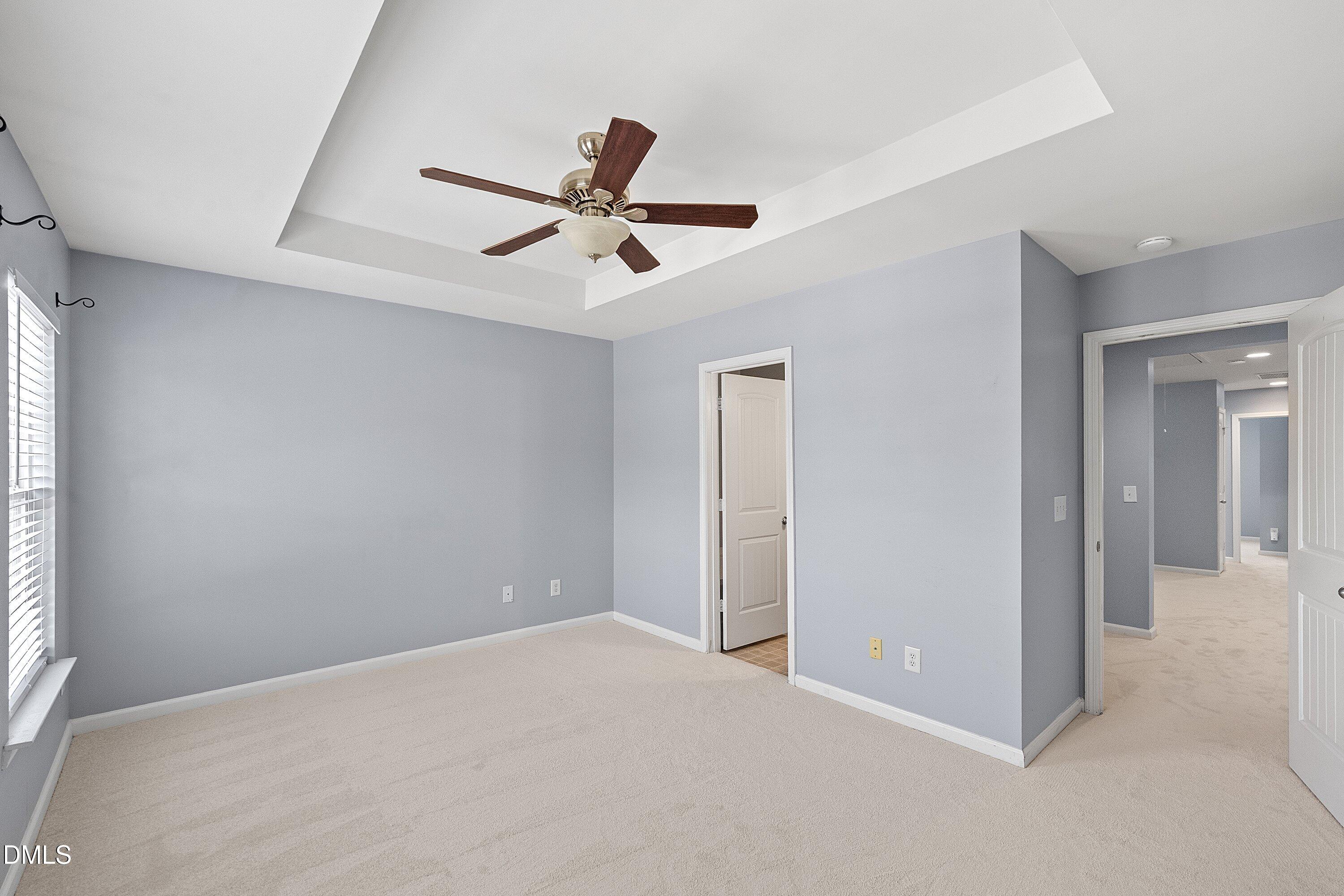 3114 Rapid Falls Road Cary, NC 27519 - Photo 23 of 37 a view of a livingroom with a ceiling fan & window