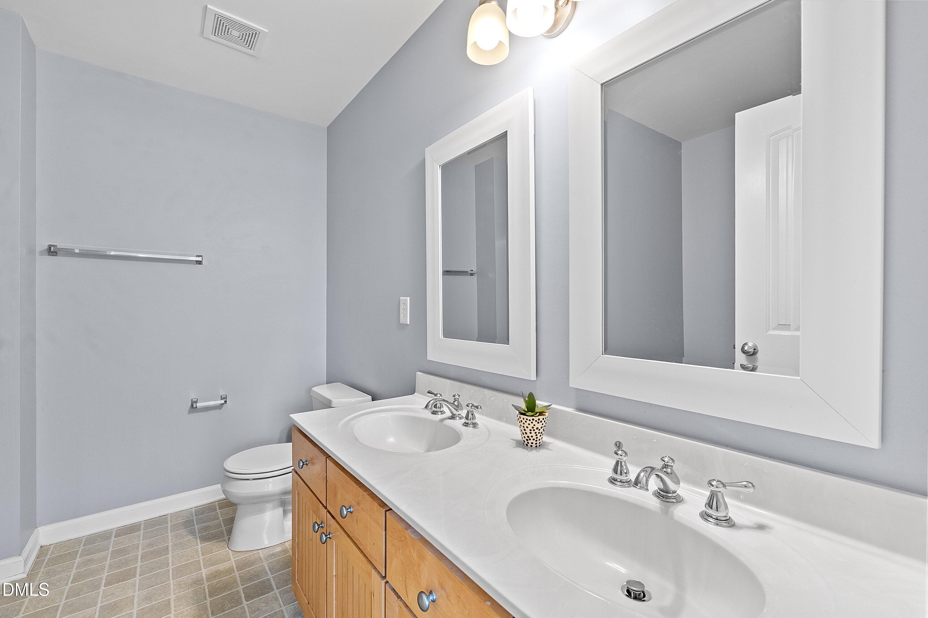 3114 Rapid Falls Road Cary, NC 27519 - Photo 27 of 37 a bathroom with a sink and a toilet