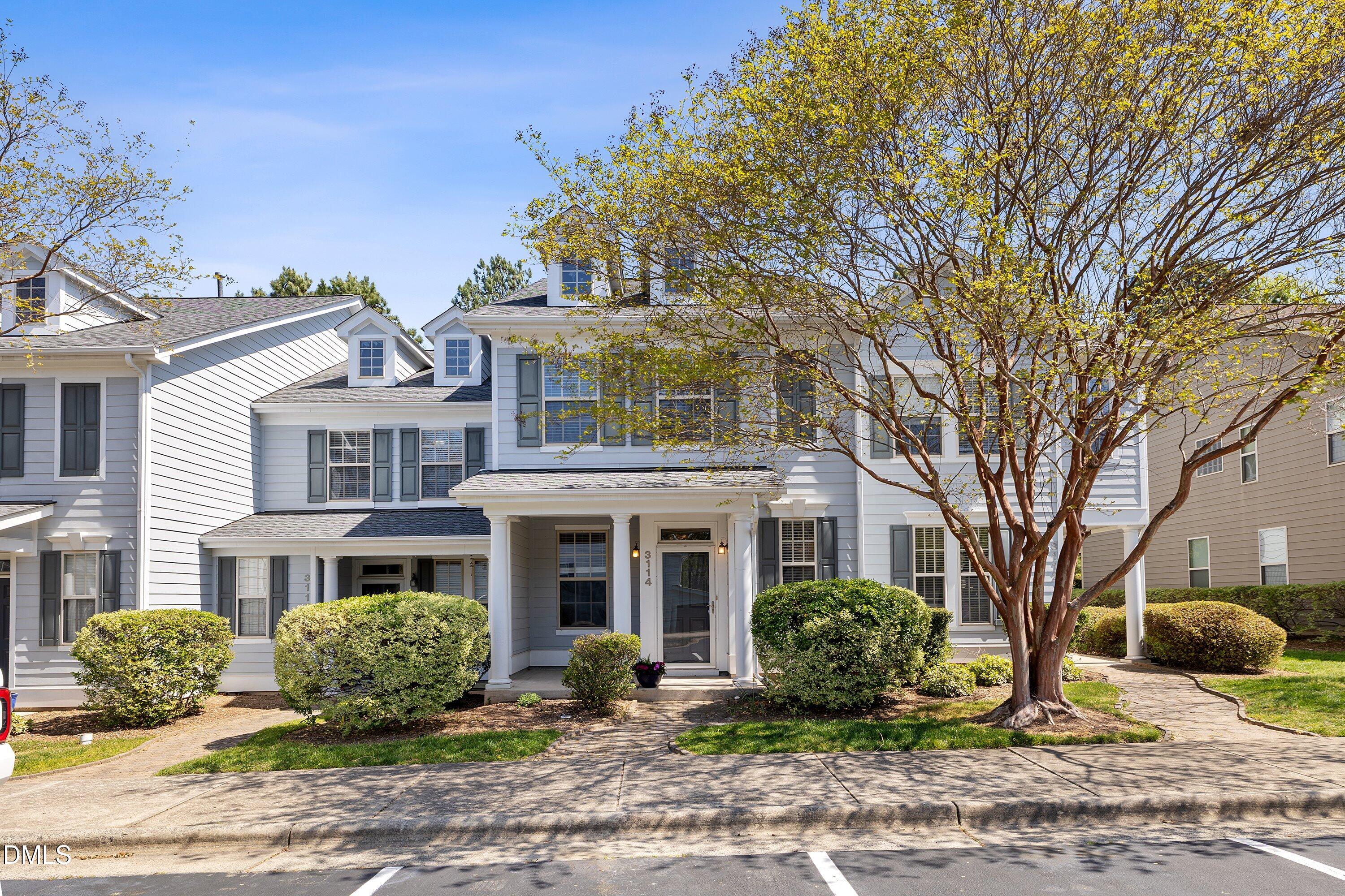 3114 Rapid Falls Road Cary, NC 27519 - Photo 3 of 37 a view of a brick building next to a yard