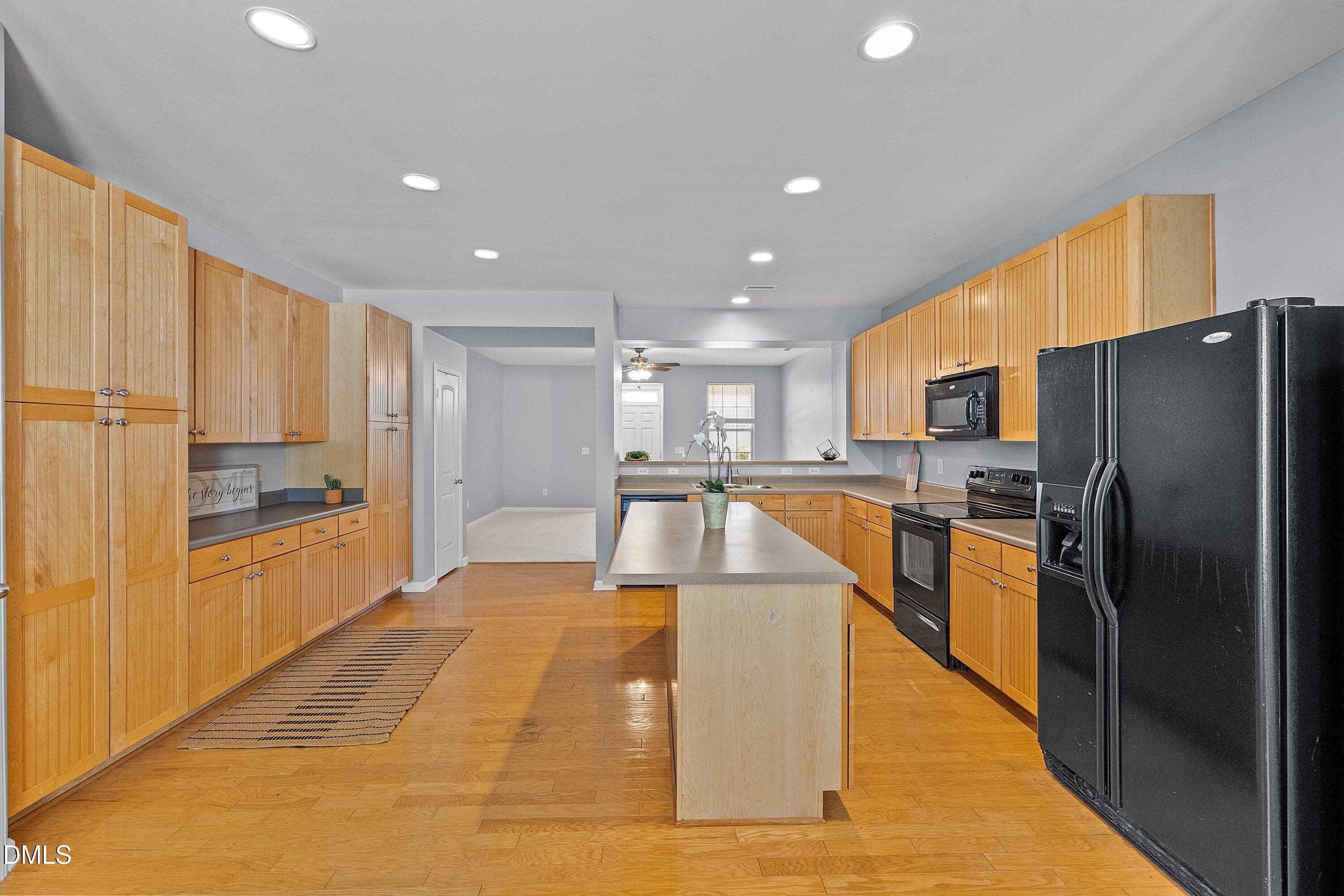 3114 Rapid Falls Road Cary, NC 27519 - Photo 9 of 37 a large kitchen with stainless steel appliances granite countertop a refrigerator a oven and a sink
