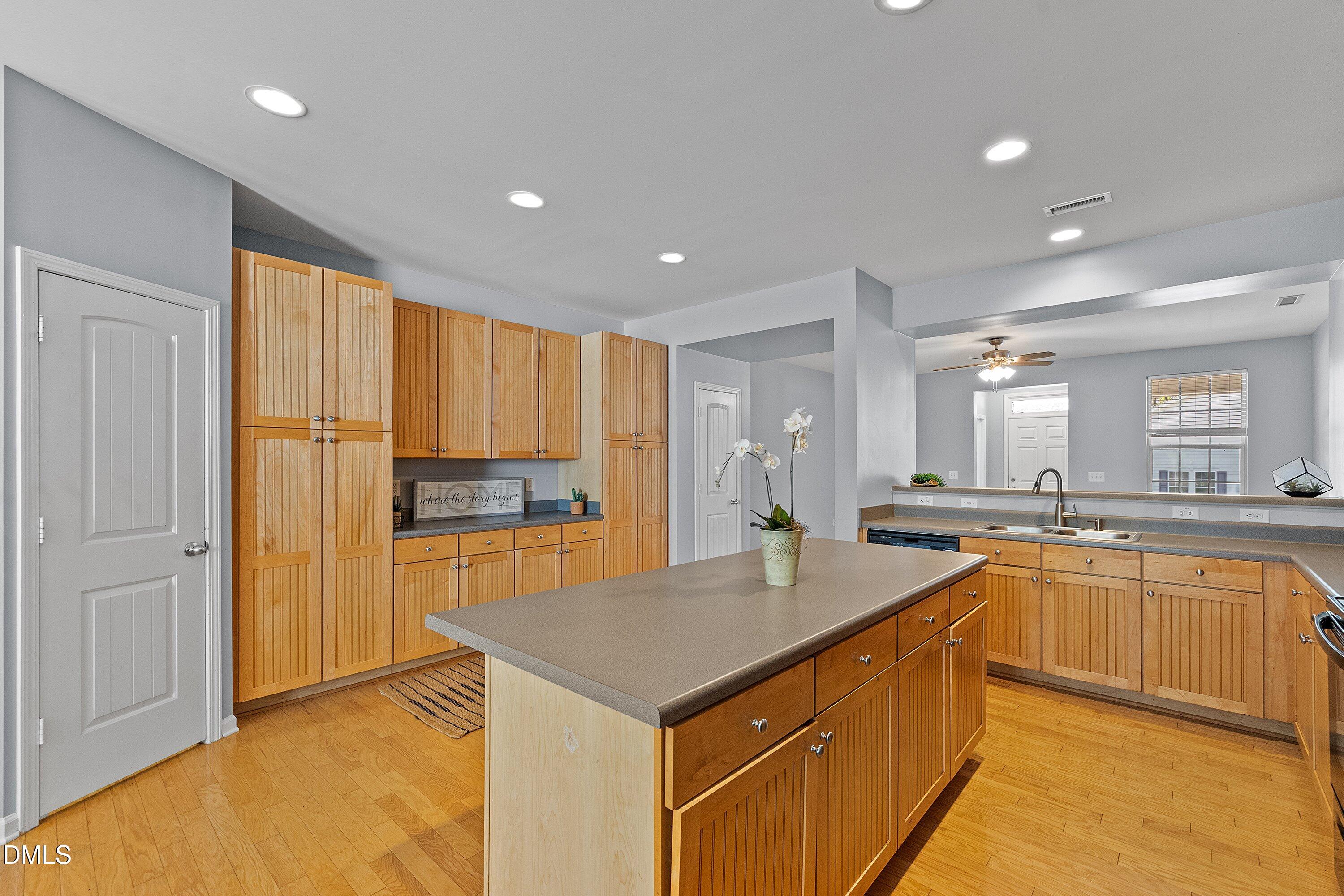 3114 Rapid Falls Road Cary, NC 27519 - Photo 10 of 37 a kitchen with a sink refrigerator and cabinets