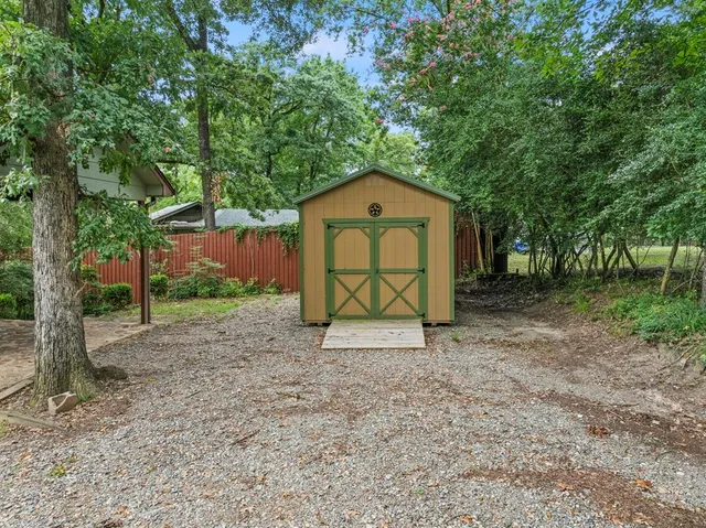 a view of backyard with green space