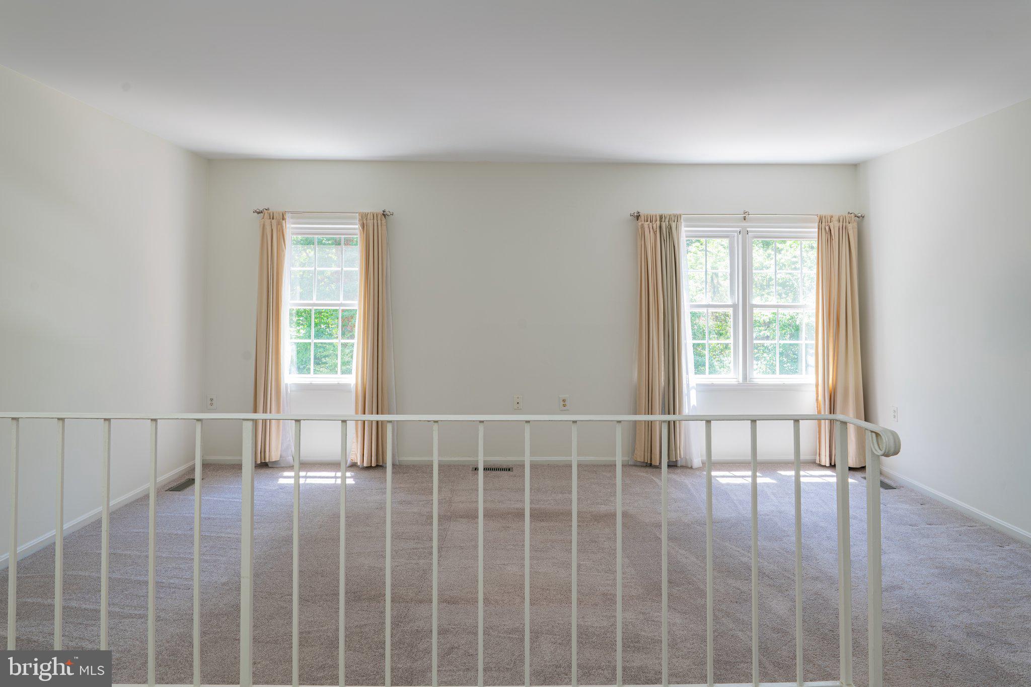 2913 Seminole Road Woodbridge, VA 22192 - Photo 10 of 34 a view of an empty room with wooden floor and a window