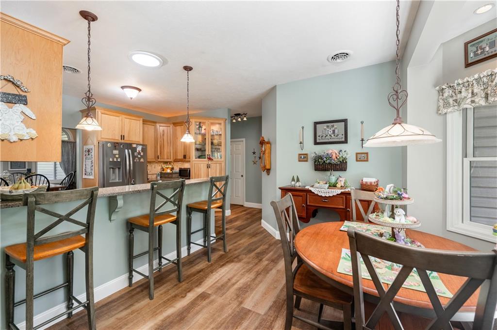 825 Whitestown Road Butler, PA 16001 - Photo 12 of 49 a view of a dining room with furniture and a chandelier