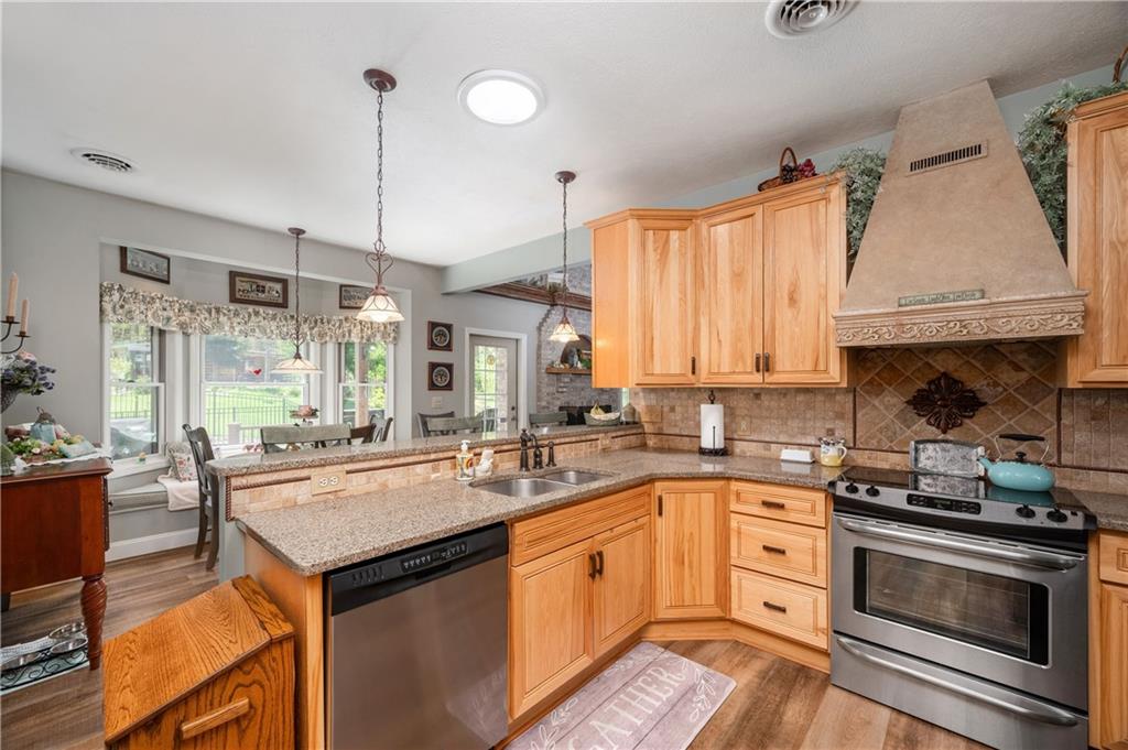 825 Whitestown Road Butler, PA 16001 - Photo 16 of 49 a kitchen with a sink stove and cabinets