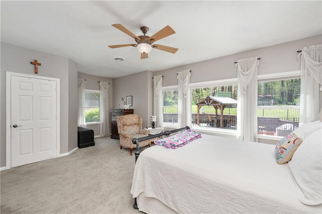 825 Whitestown Road Butler, PA 16001 - Photo 21 of 49 a bedroom with a bed and large window