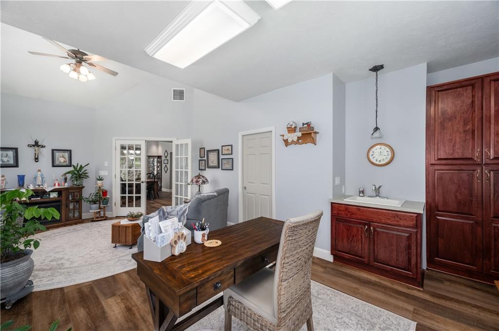 825 Whitestown Road Butler, PA 16001 - Photo 27 of 49 a living room with furniture a dining table and wooden floor