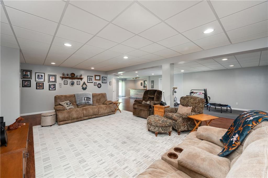 825 Whitestown Road Butler, PA 16001 - Photo 31 of 49 a living room with furniture and a flat screen tv