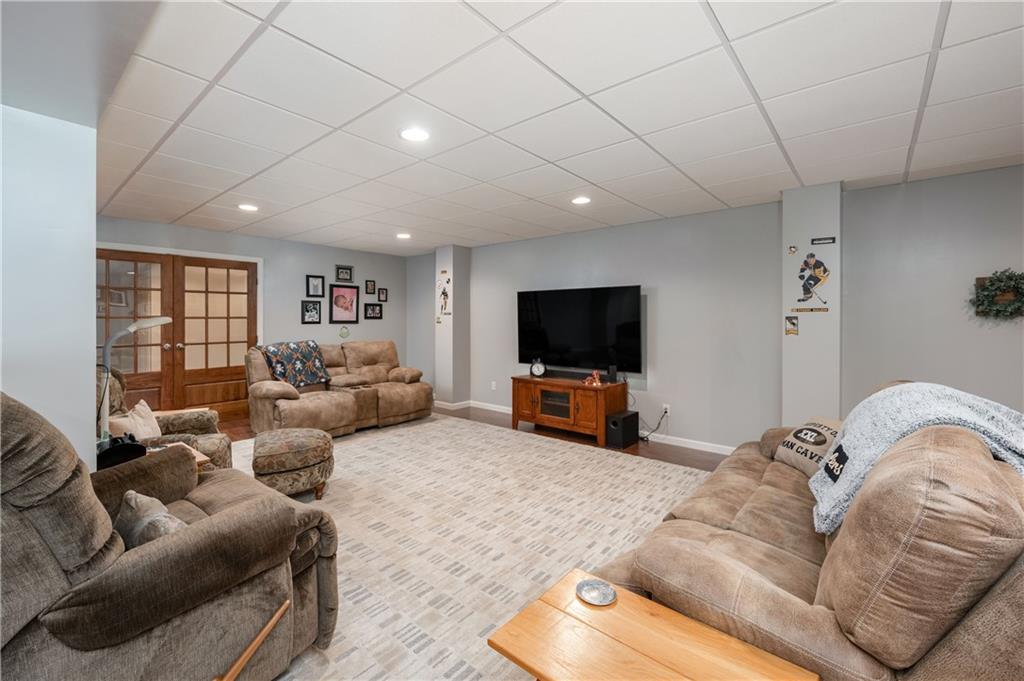 825 Whitestown Road Butler, PA 16001 - Photo 33 of 49 a living room with furniture and a flat screen tv