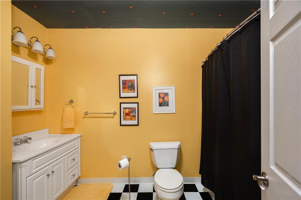825 Whitestown Road Butler, PA 16001 - Photo 35 of 49 a bathroom with a toilet sink and mirror