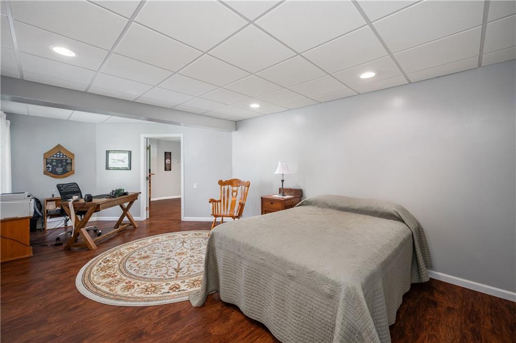 825 Whitestown Road Butler, PA 16001 - Photo 36 of 49 a bed room with furniture and wooden floor