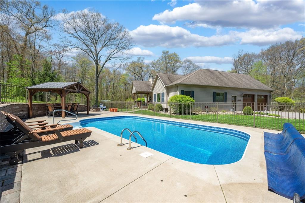 825 Whitestown Road Butler, PA 16001 - Photo 41 of 49 a view of a house with swimming pool and sitting area