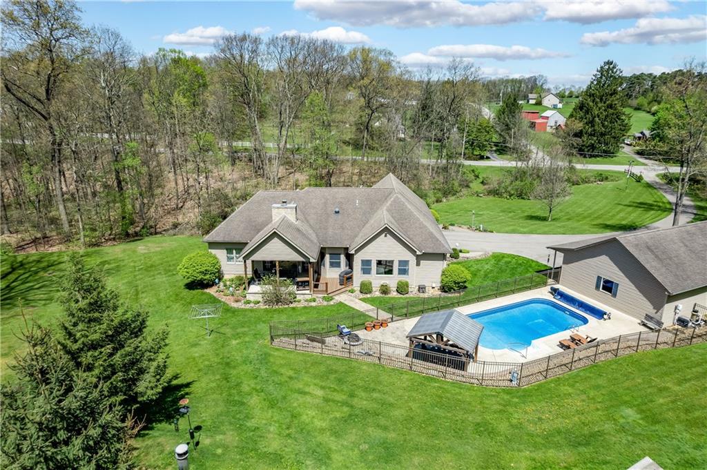 825 Whitestown Road Butler, PA 16001 - Photo 46 of 49 an aerial view of a house with swimming pool garden and tall trees
