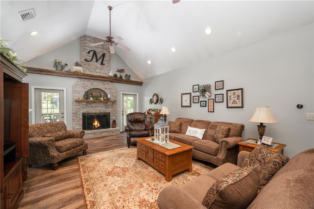 825 Whitestown Road Butler, PA 16001 - Photo 8 of 49 a living room with furniture a fireplace and a chandelier