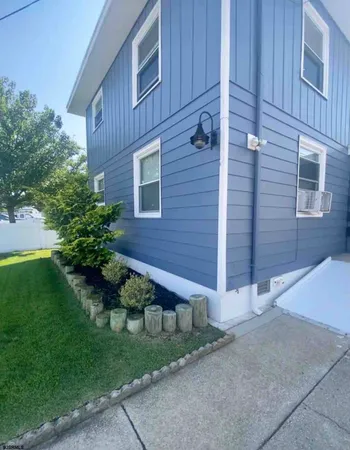 a front view of a house with stairs