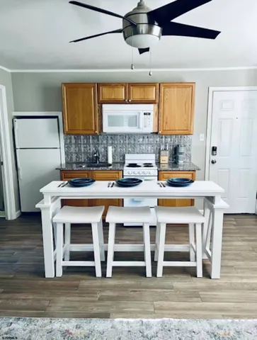 a kitchen with a sink cabinets and window