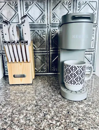 a bedroom with a bed and a wooden floor