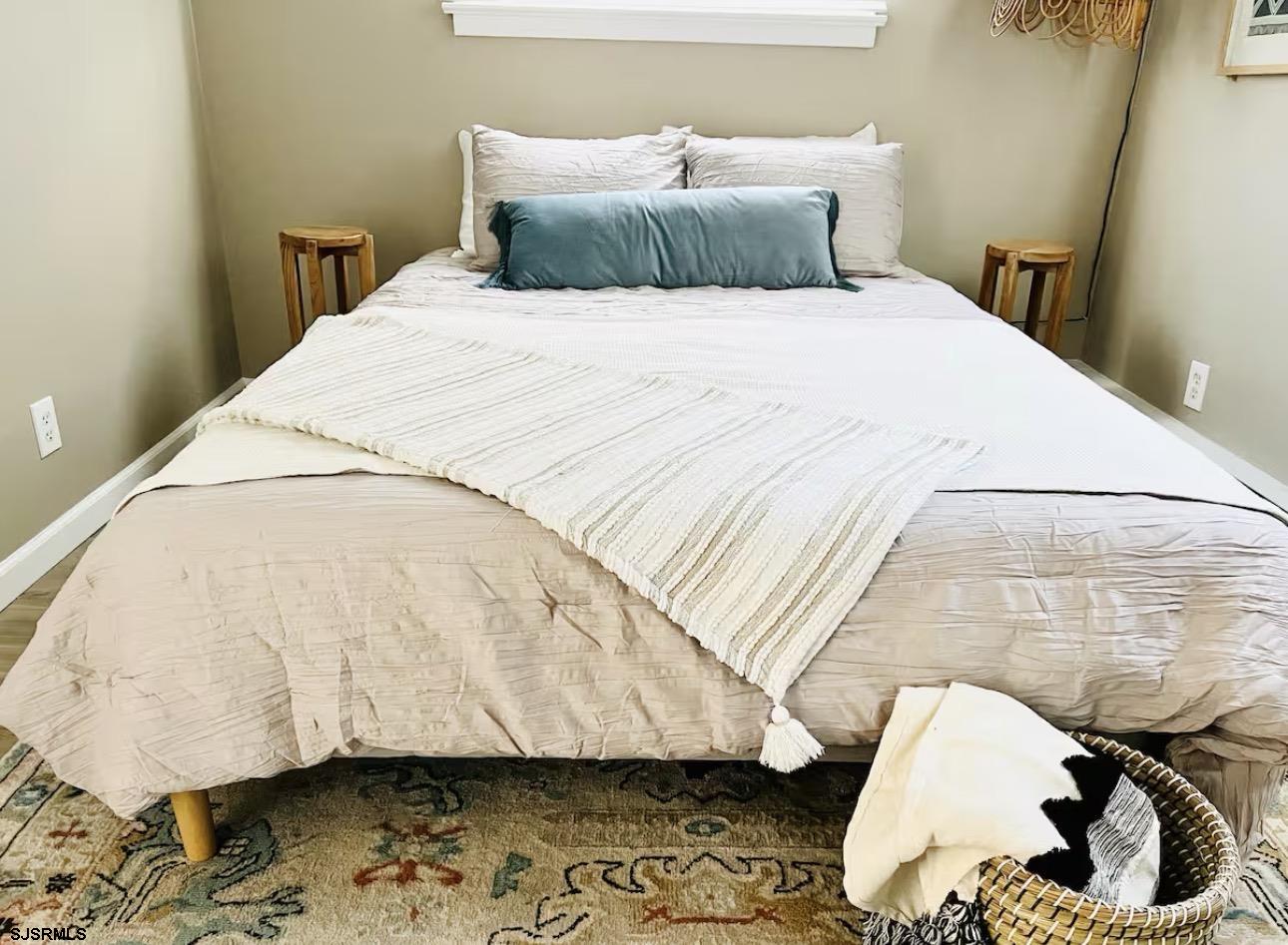 512 West Brigantine Avenue, Unit B Brigantine, NJ 08203 - Photo 7 of 22 a bedroom with a bed and a wooden floor