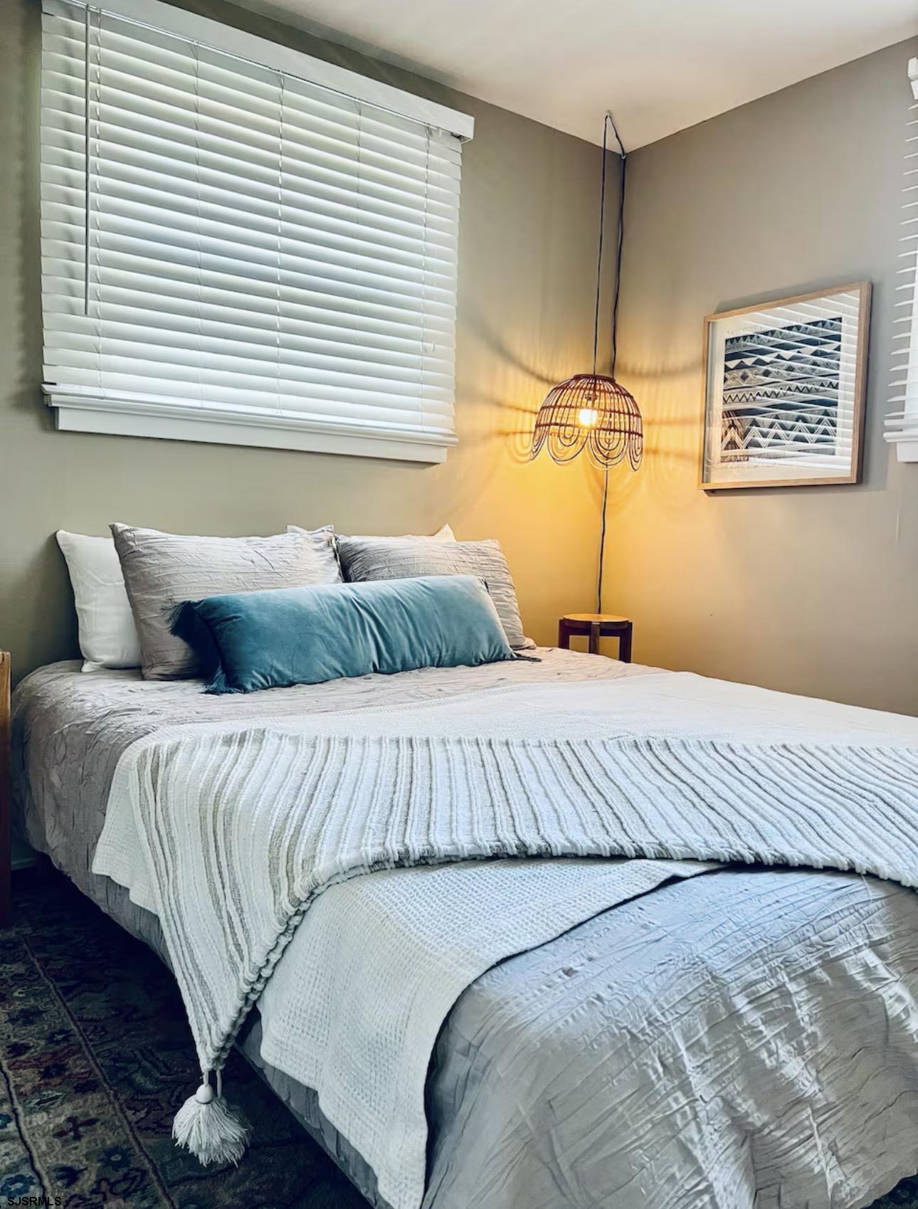 512 West Brigantine Avenue, Unit B Brigantine, NJ 08203 - Photo 8 of 22 a bedroom with a bed and a window