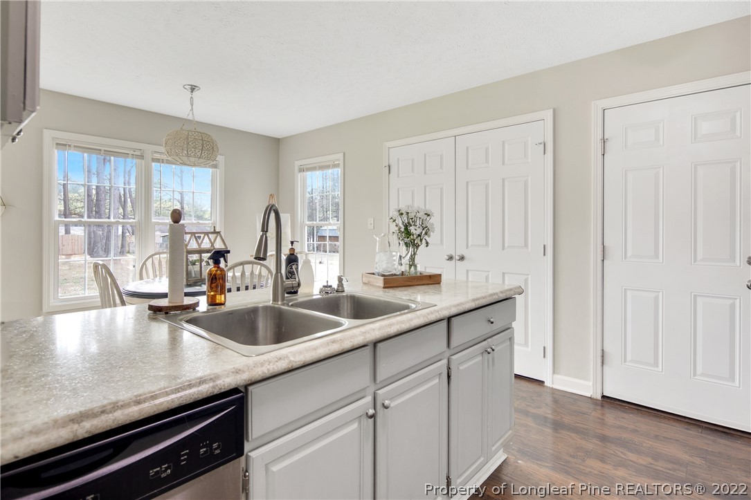 7096 Rockfish Road Raeford, NC 28376 - Photo 16 of 40 a kitchen with a sink and cabinets