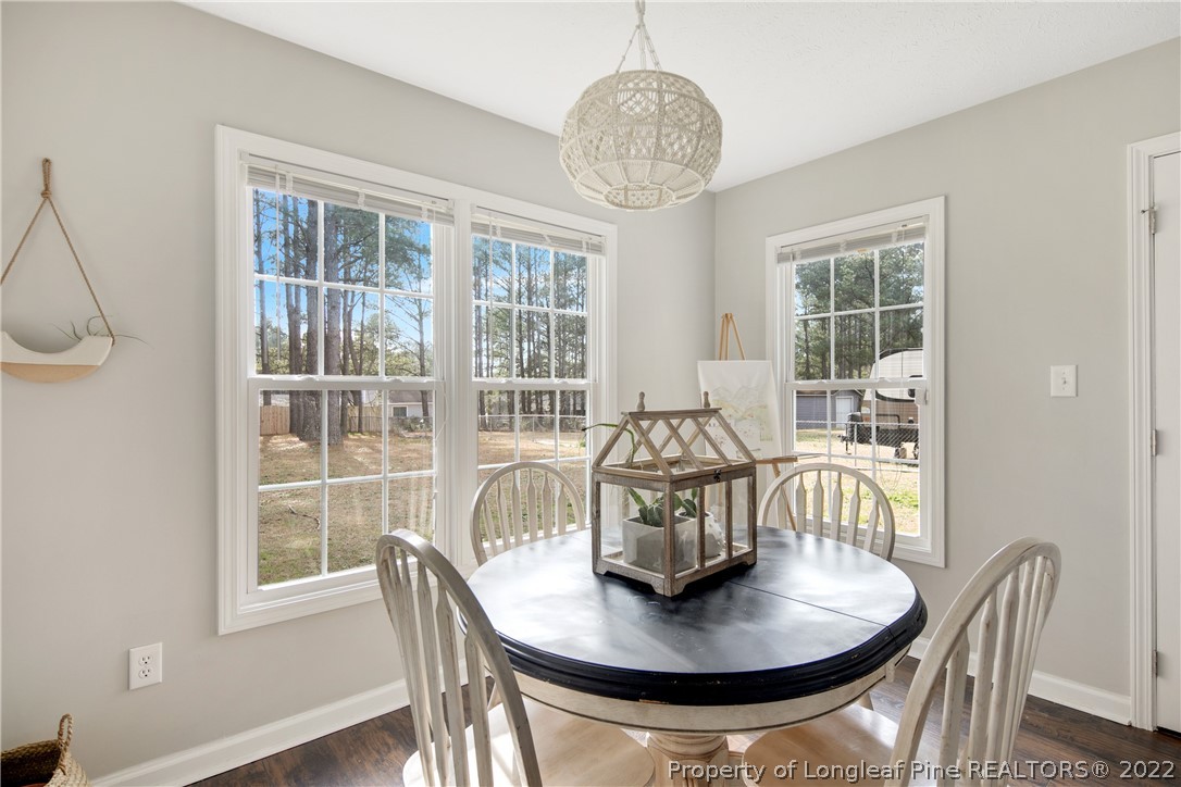 7096 Rockfish Road Raeford, NC 28376 - Photo 18 of 40 a view of a dining room with furniture window and outside view