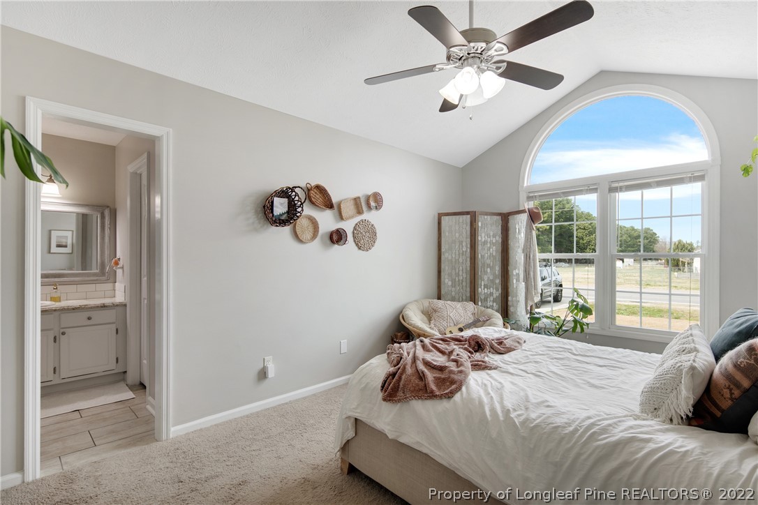 7096 Rockfish Road Raeford, NC 28376 - Photo 23 of 40 a bedroom with a bed and a large window