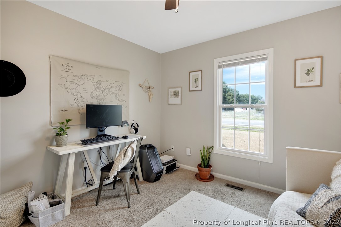 7096 Rockfish Road Raeford, NC 28376 - Photo 31 of 40 a view of a livingroom with workspace and a window