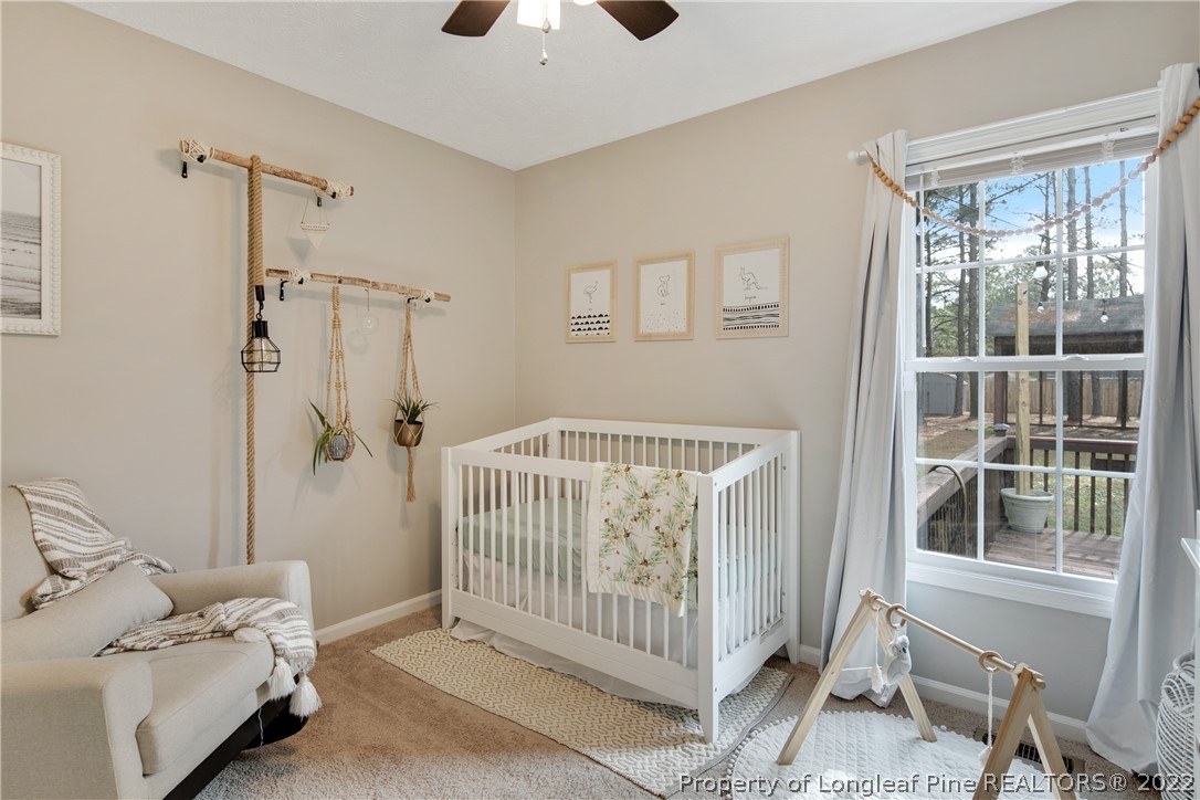 7096 Rockfish Road Raeford, NC 28376 - Photo 32 of 40 a bedroom with a bed and a window
